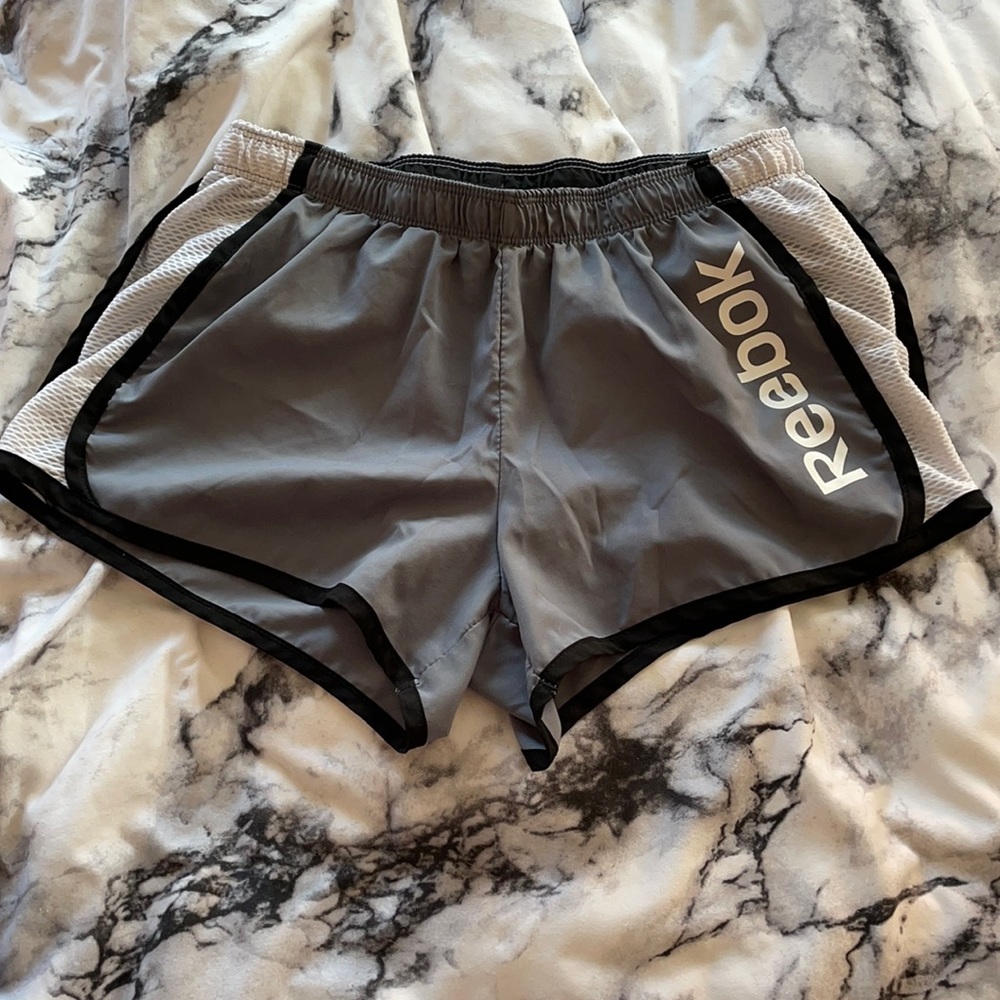 Reebok track shorts.
